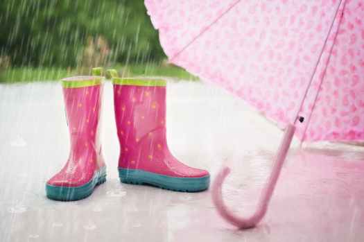 red and gray rain boots near pink umbrella